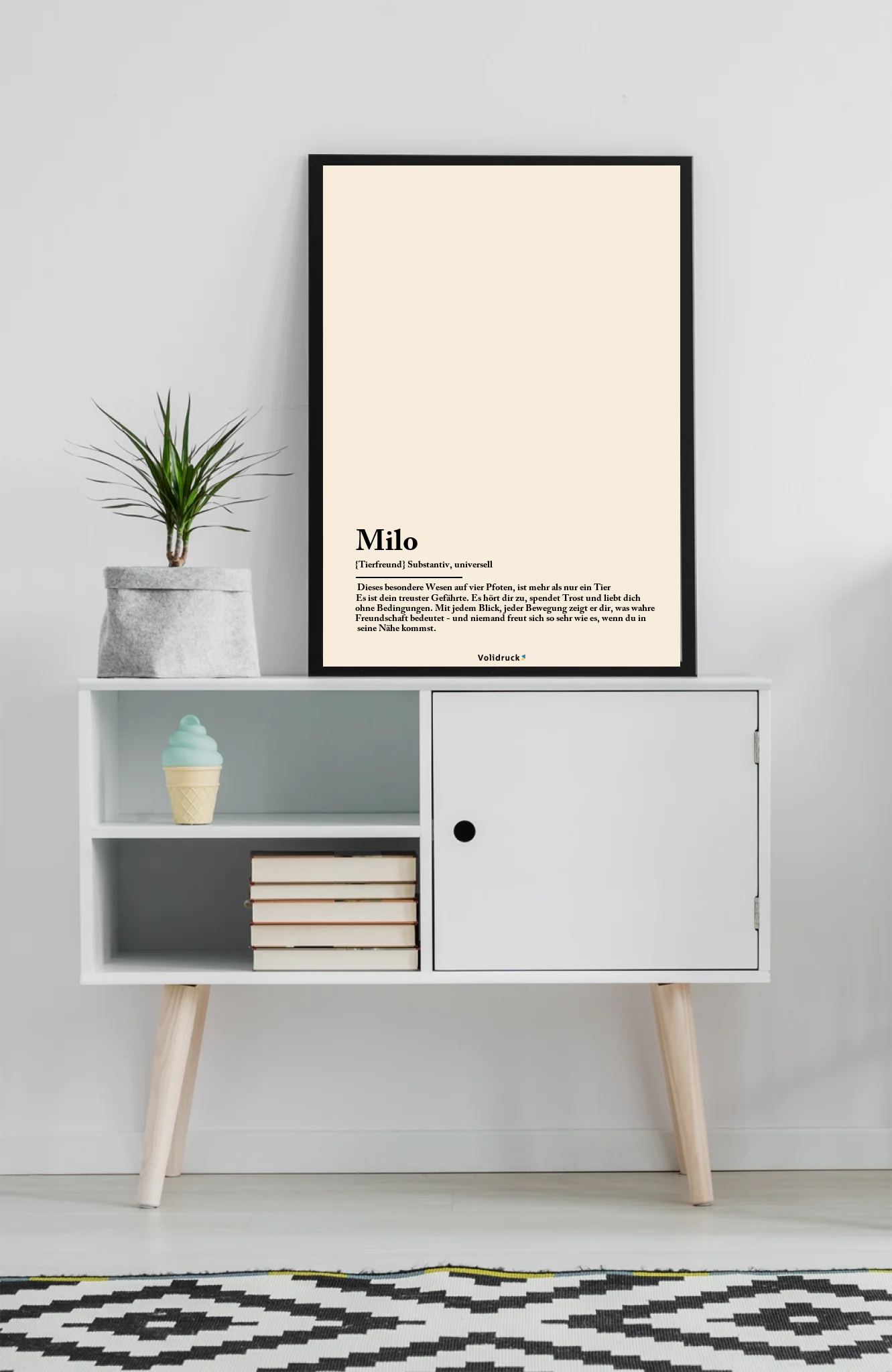 mockup-of-an-art-print-placed-on-a-minimalist-furniture-with-a-plant-38693-r-el2